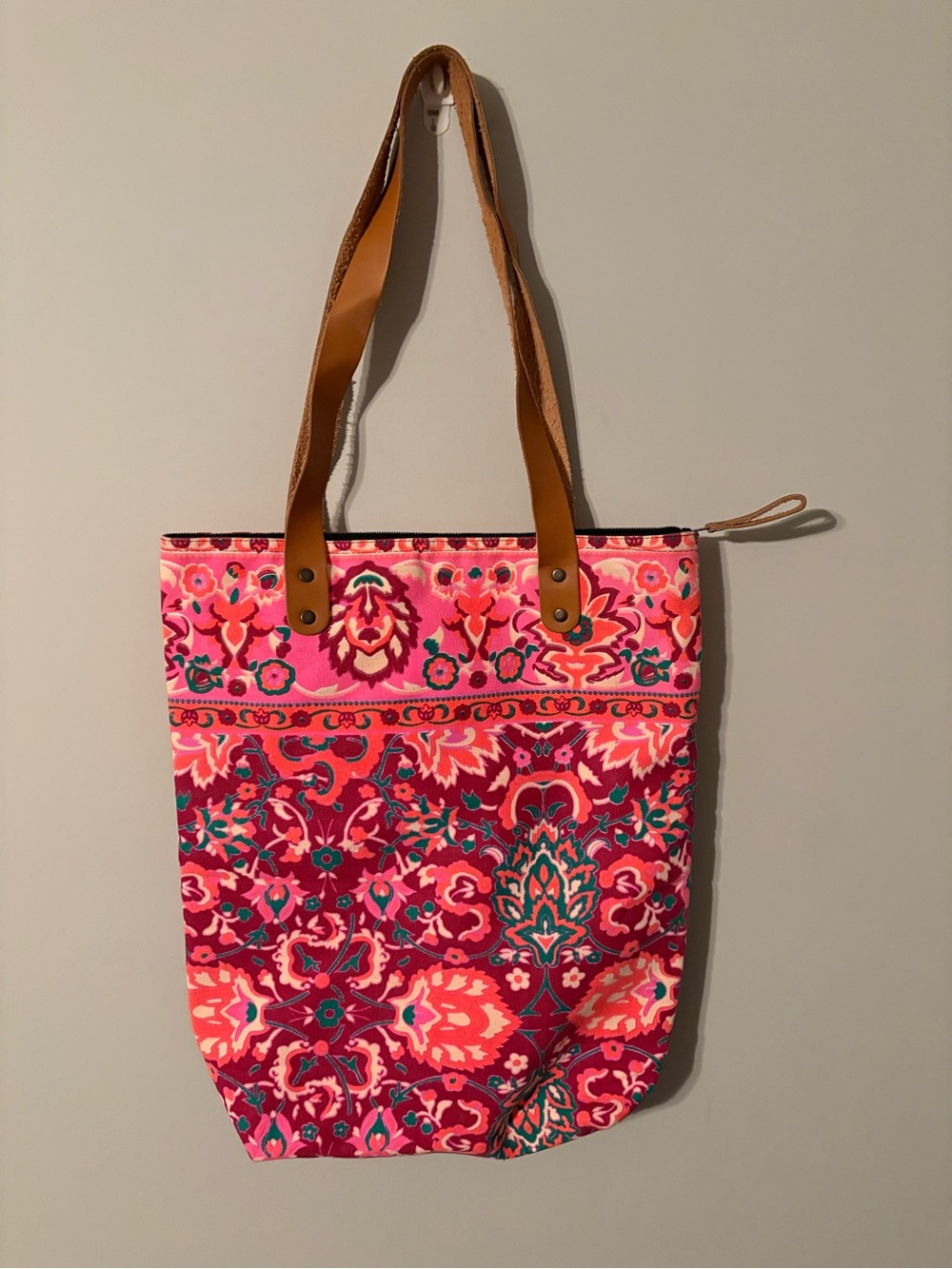 Vibrant pink and orange floral tote bag with tan straps